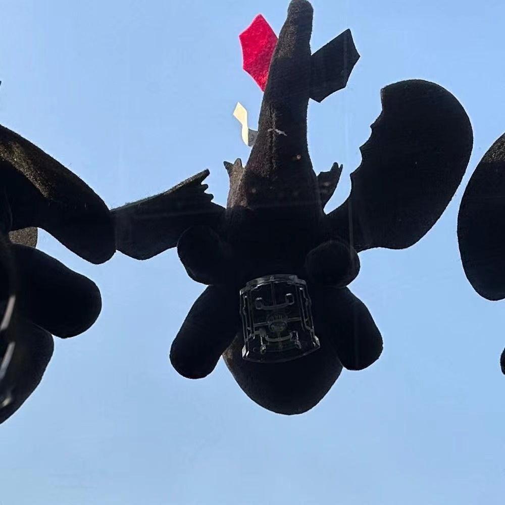 Helmet car suction doll motorcycle motorcycle ski decoration doll wings can move flying dragon